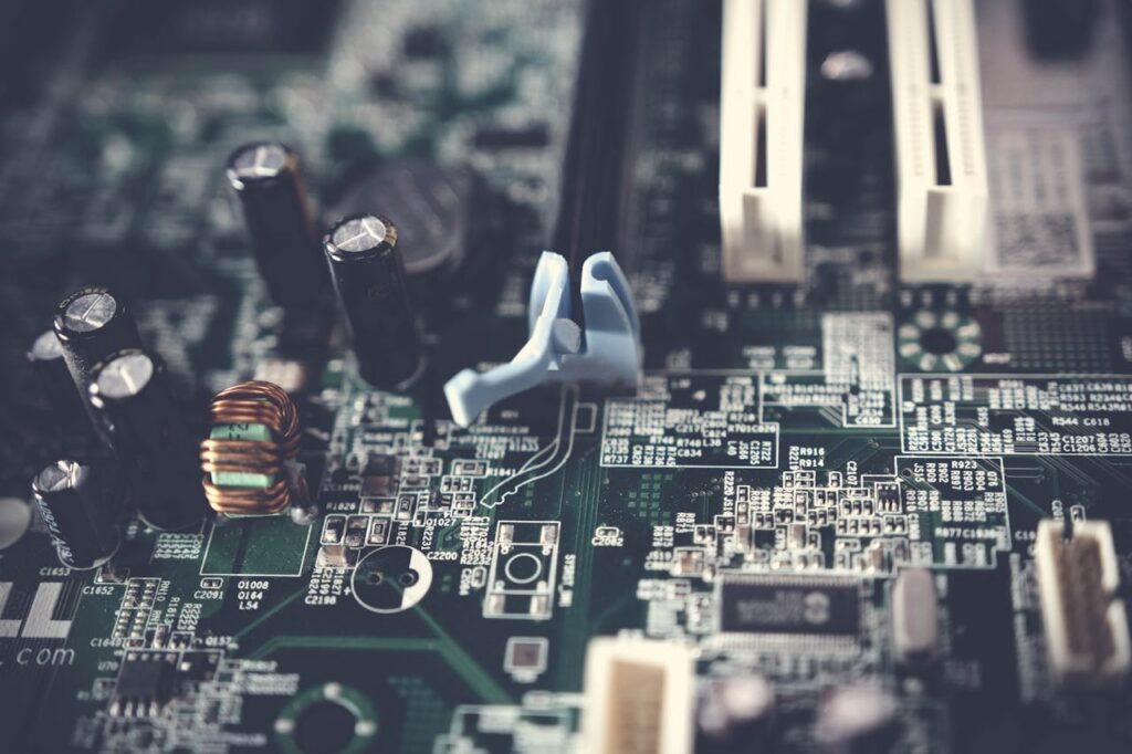 Detailed view of components on a computer motherboard, showcasing technology and circuitry.